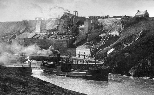 Photo of Portgain stone hoppers and crusher with steamship leaving harbour